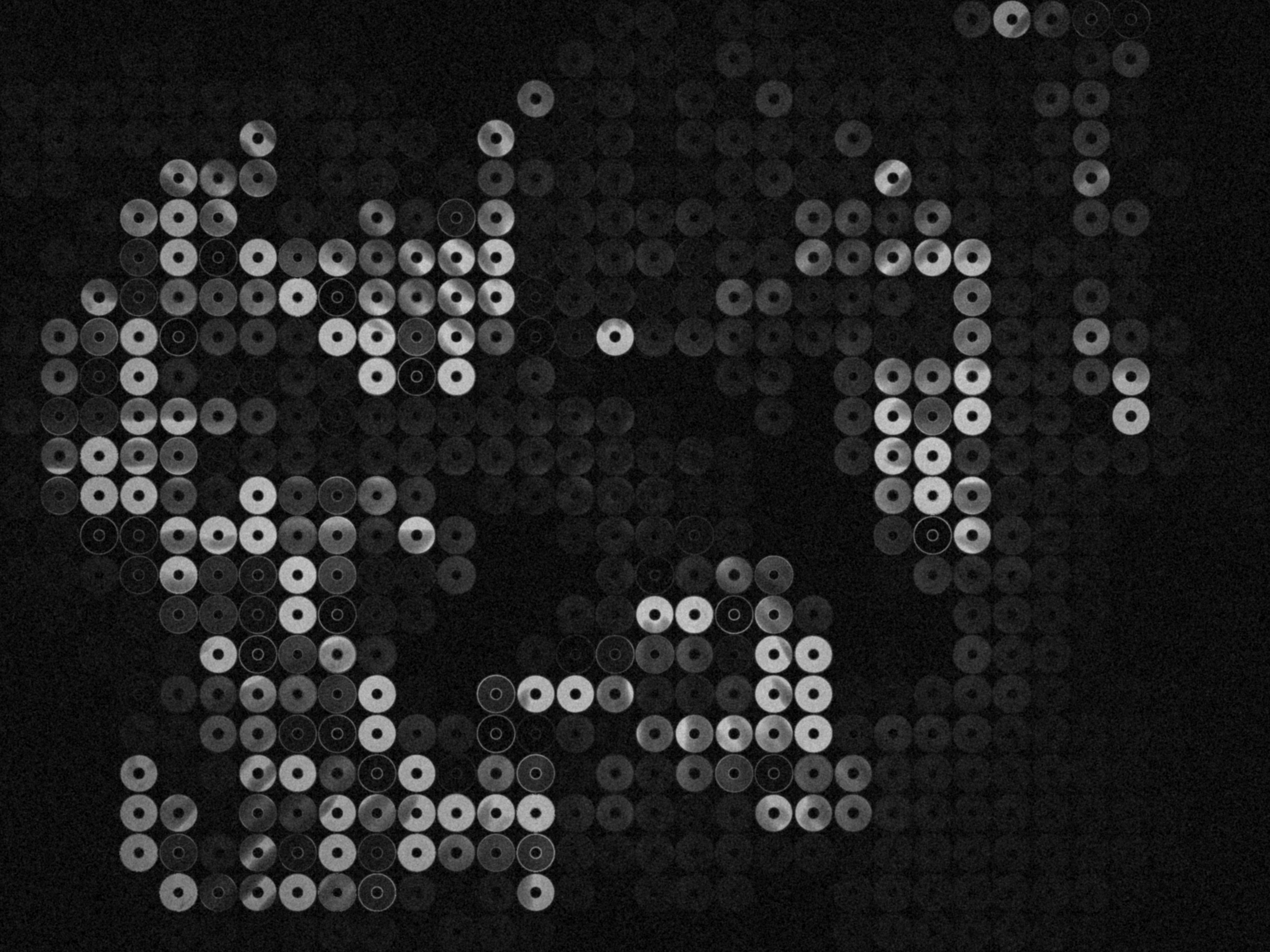 a black and white photo of a word that is made up of circles